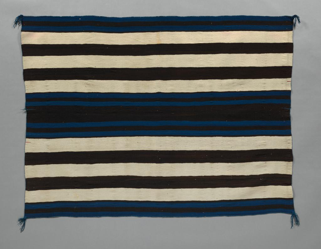 Diné blanket, circa 1850, handspun undyed and indigo-dyed Churro fleece and raveled lac-dyed bayeta