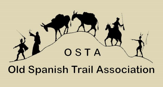 mules, a priest, a Spaniard, a trapper, an Indian travel the trail - logo