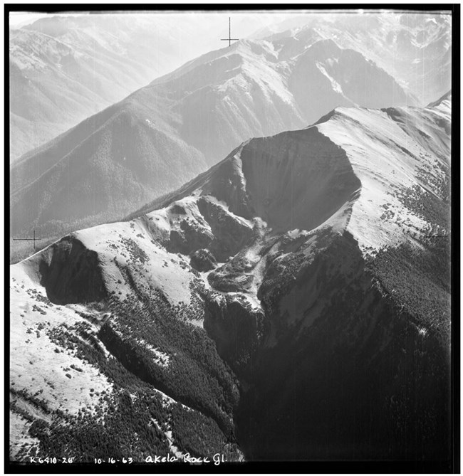 An aerial view of a rocky mountaintop, labeled K6410 26, 10-16-63, Akela Rock. Gl