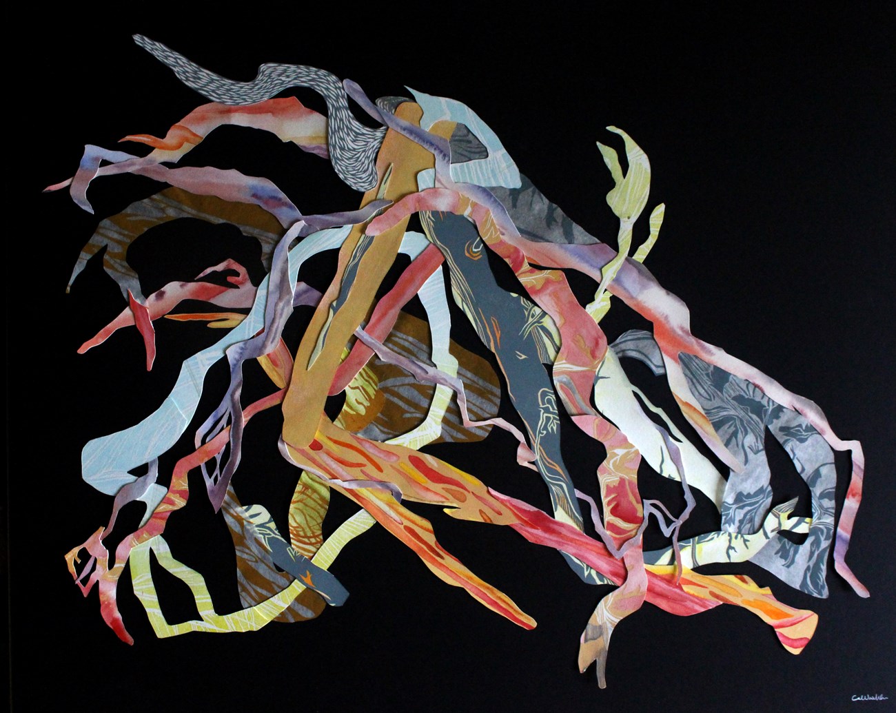Layers of paper with different patterns and colors, each piece cut into twisted and branching shapes that layer over and intertwine with one another.