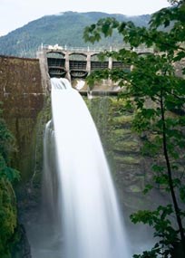 Water pours out of a spillway on the Glines Canyon Dam. The photographer that took this picture used a long shutter speed, giving the waterfall a smoother, dramatic effect.