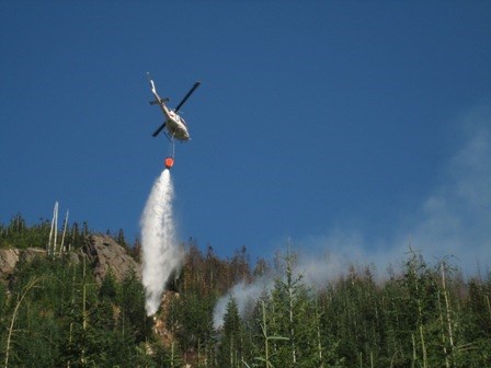 Helicopter doing bucket work