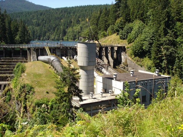Elwha Dam powerhouse and surge tank as viewed from just north of the dam and Lake Aldwell.