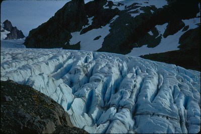 This image depicts the crevasses of a glacier, showing a blue hue.