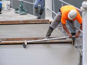 Pouring concrete on the walkway over the spillway.