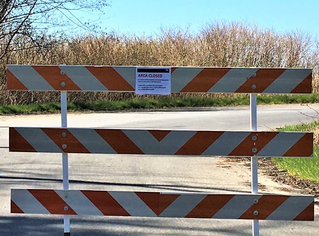 All coastal areas of Olympic National Park are now closed to park visitors until further notice. Barricade on a park entrance road with a sign saying Area Closed