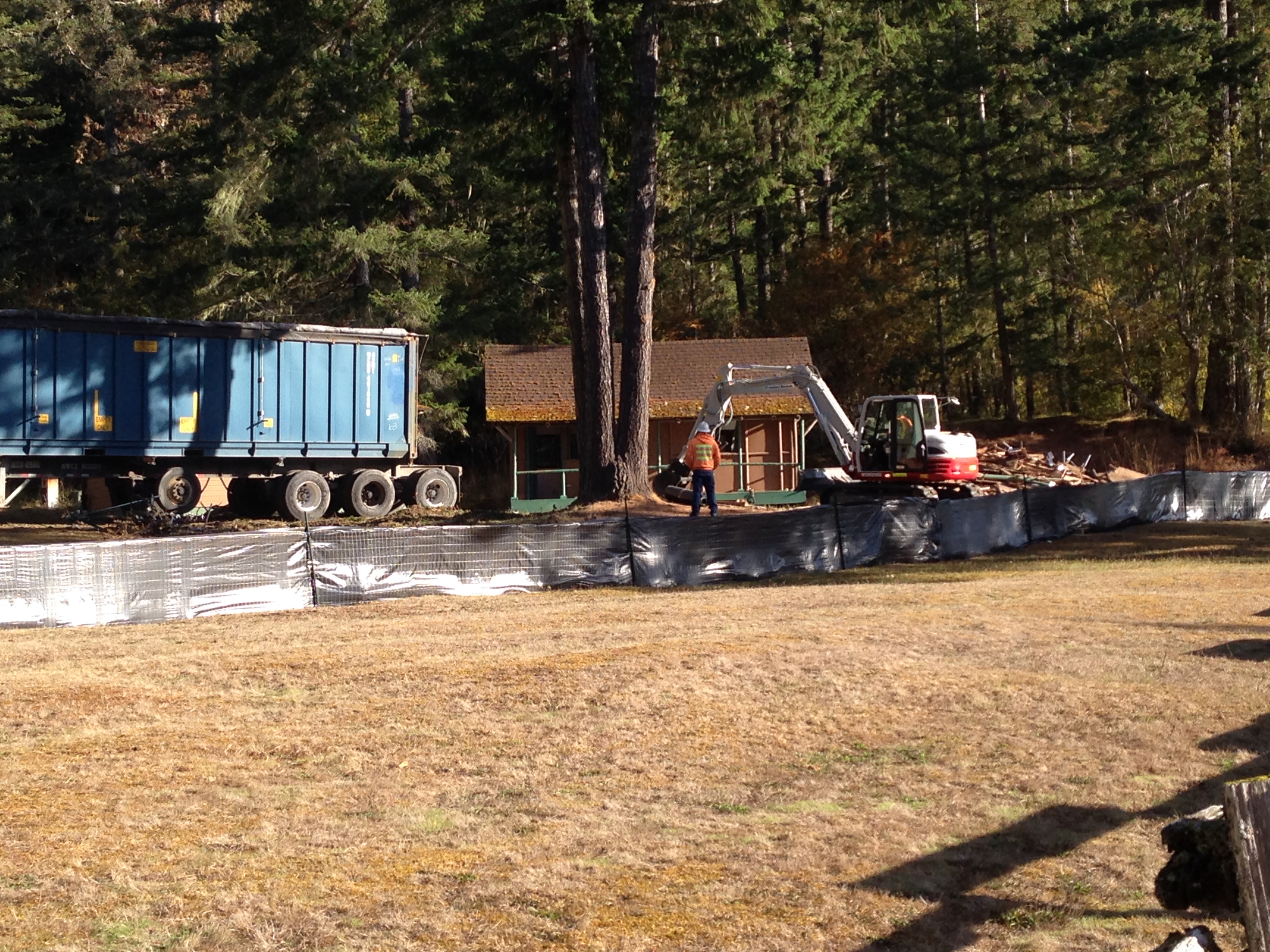 Demolition underway on deteriorated cabin