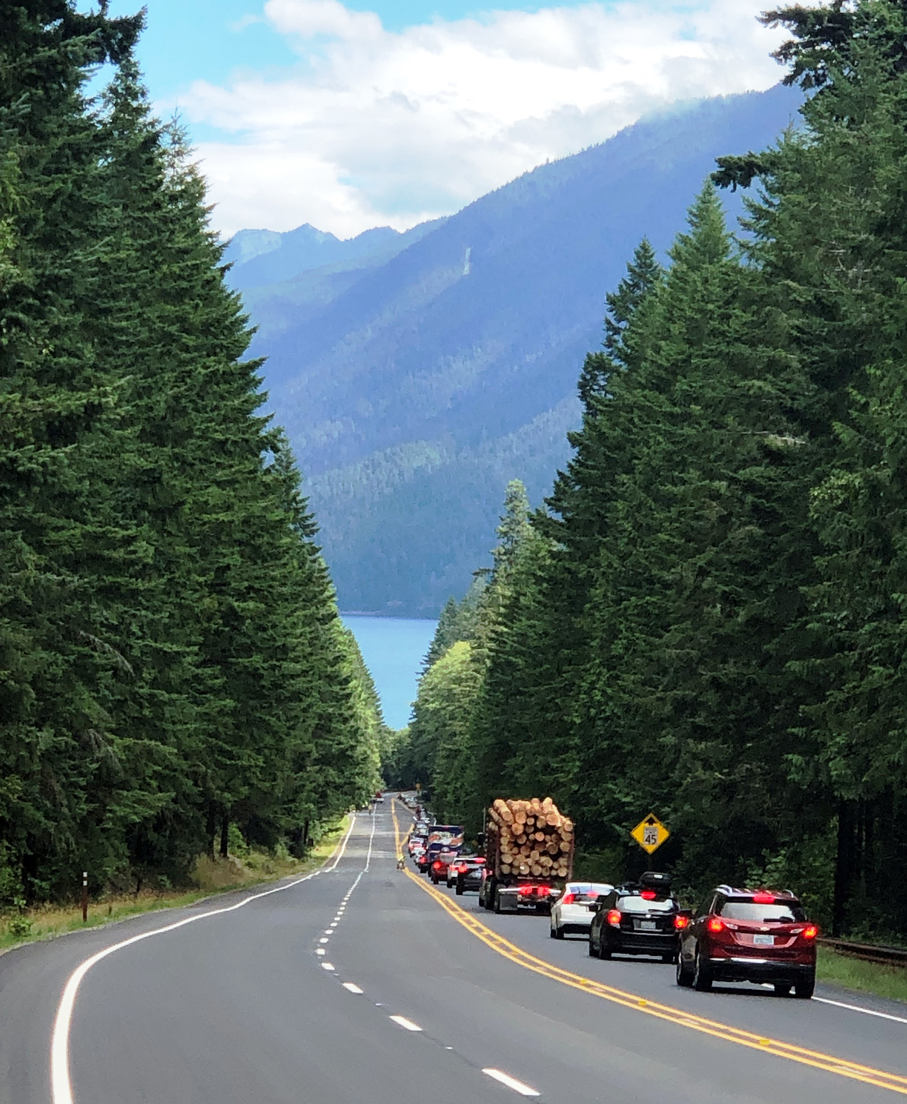 Traffic headed down the newly paved and striped Highway 101 on Fairholme Hill at Lake Crescent Traffic on Highway 101 at Lake Crescent