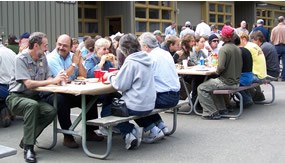people seated at picnic tables