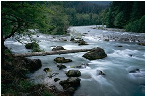 river flowing among boulders river flowing among boulders