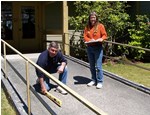 two people outside a building