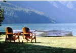 two chairs near lakeshore