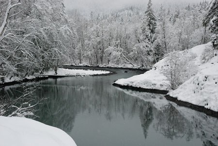 Snow crests the banks of the Elwha River