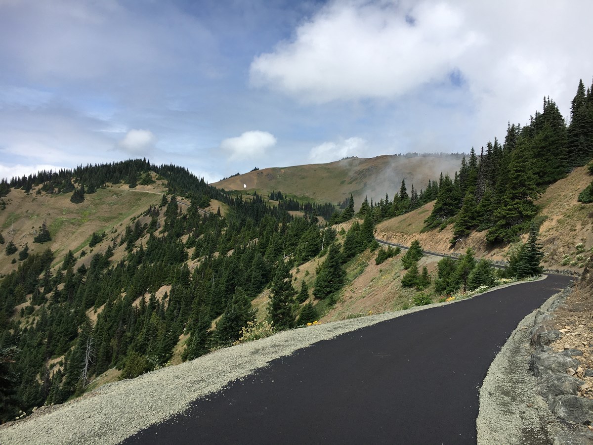 Paved trail along a mountain ridge
