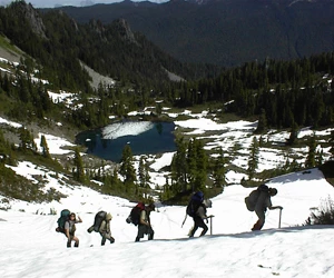 Rangers training on snow above Round Lake in the Seven Lakes Basin.