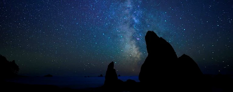 Stars light up the sky above Ruby Beach.