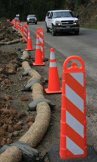 orange cones alongside road