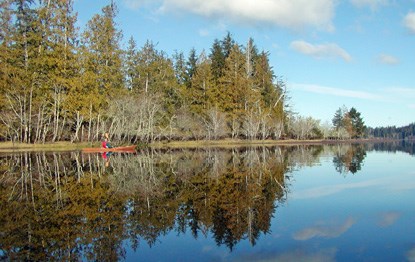 A kayaker on Lake Ozette