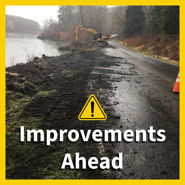 An excavator wors on a road alongside a river. A yellow caution symbol and text that reads "Improvements Ahead."