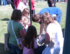 Children roll through the rock cycle becoming igneous, sedimentary, and metamorphic rocks.