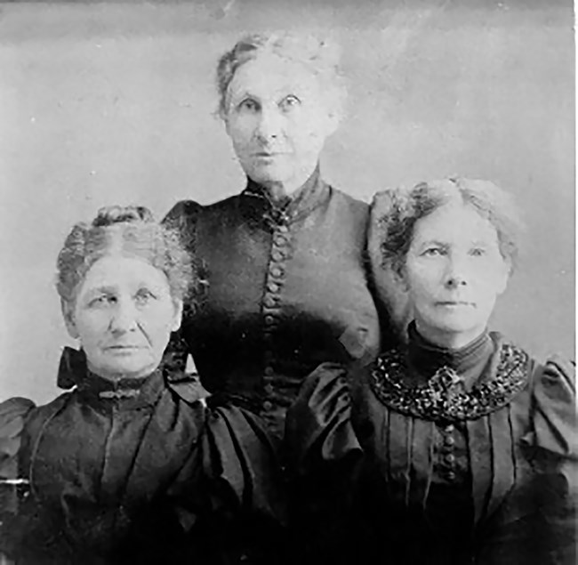 Historical portrait of three women.