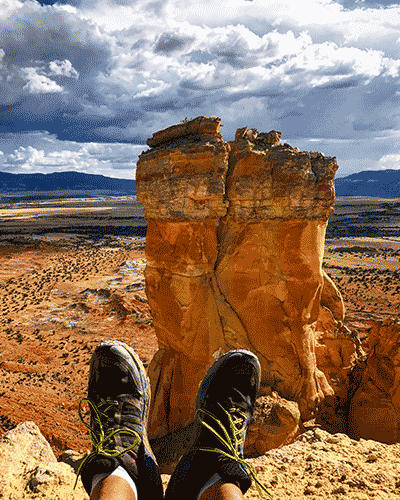 Scenic landscape in northern New Mexico including Caleb's hiking shoes to represent his time as a Teacher Ranger Teacher.