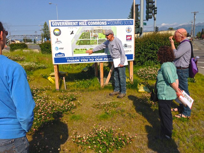 Person pointing to a park map.