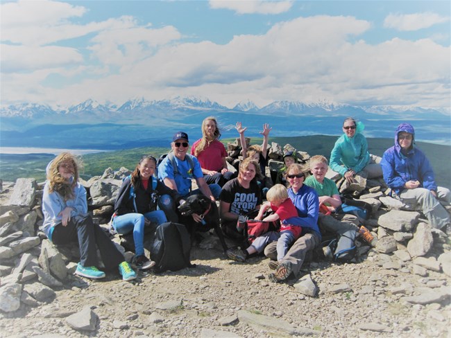 Group of hikers posing for a picture on top of Donnelly Dome.