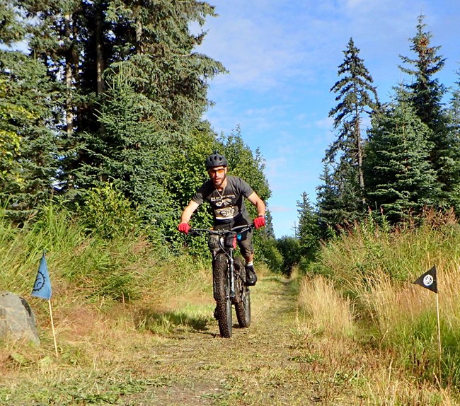 Mountain bike riding on trail. Mountain bike riding on trail.