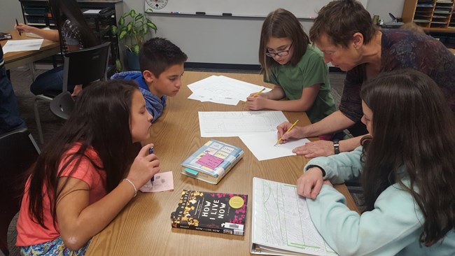 Students and teacher drawing Students and teacher drawing