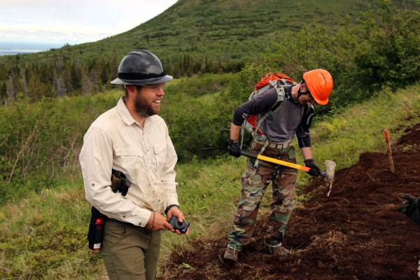 Two trail workers smiling.