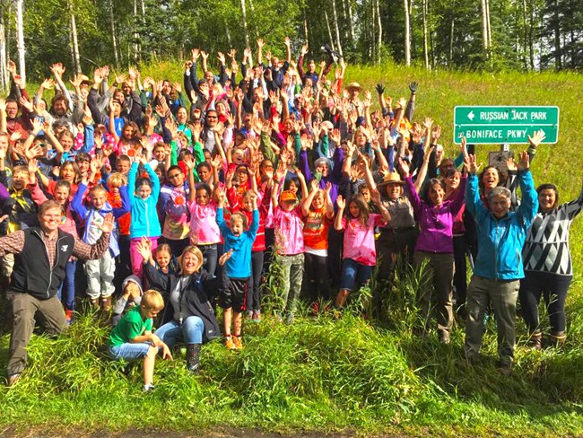 Group posing with their hands up. Group posing with their hands up.
