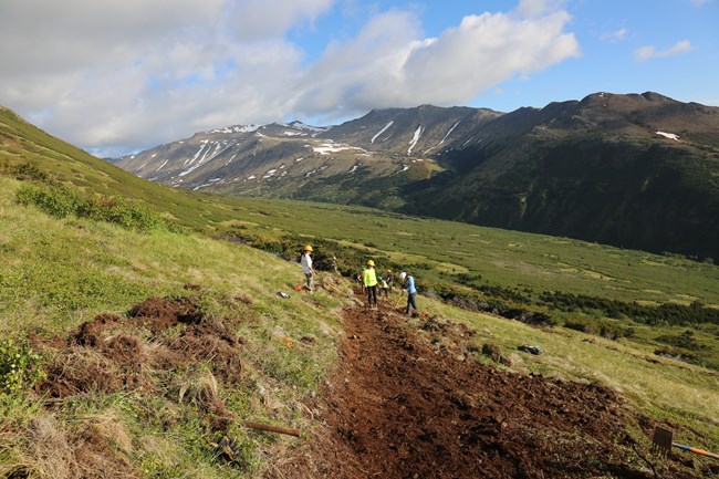 Trail with workers Volunteers working on a trail