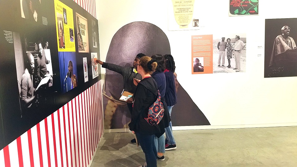 Four people looking at an exhibit at the world’s only soul music museum