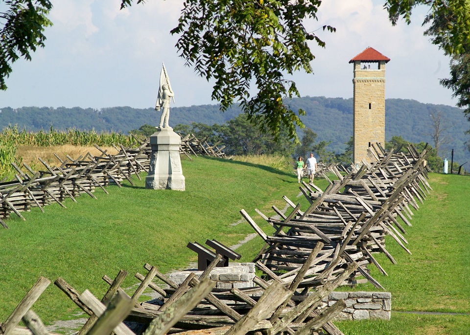 Observation tower, memorial, and picket fence