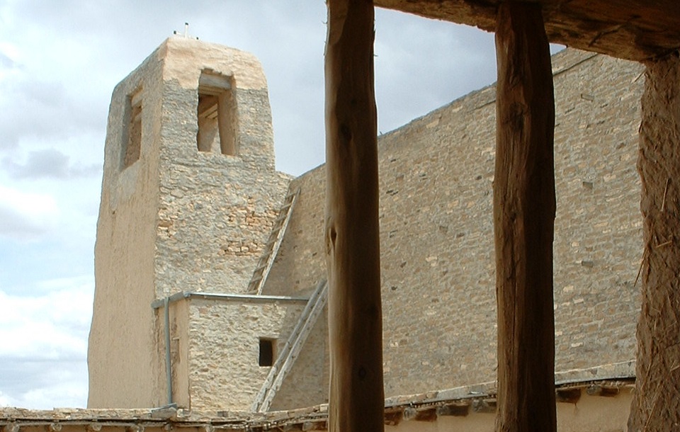 View of Pueblo tower through a wooden window