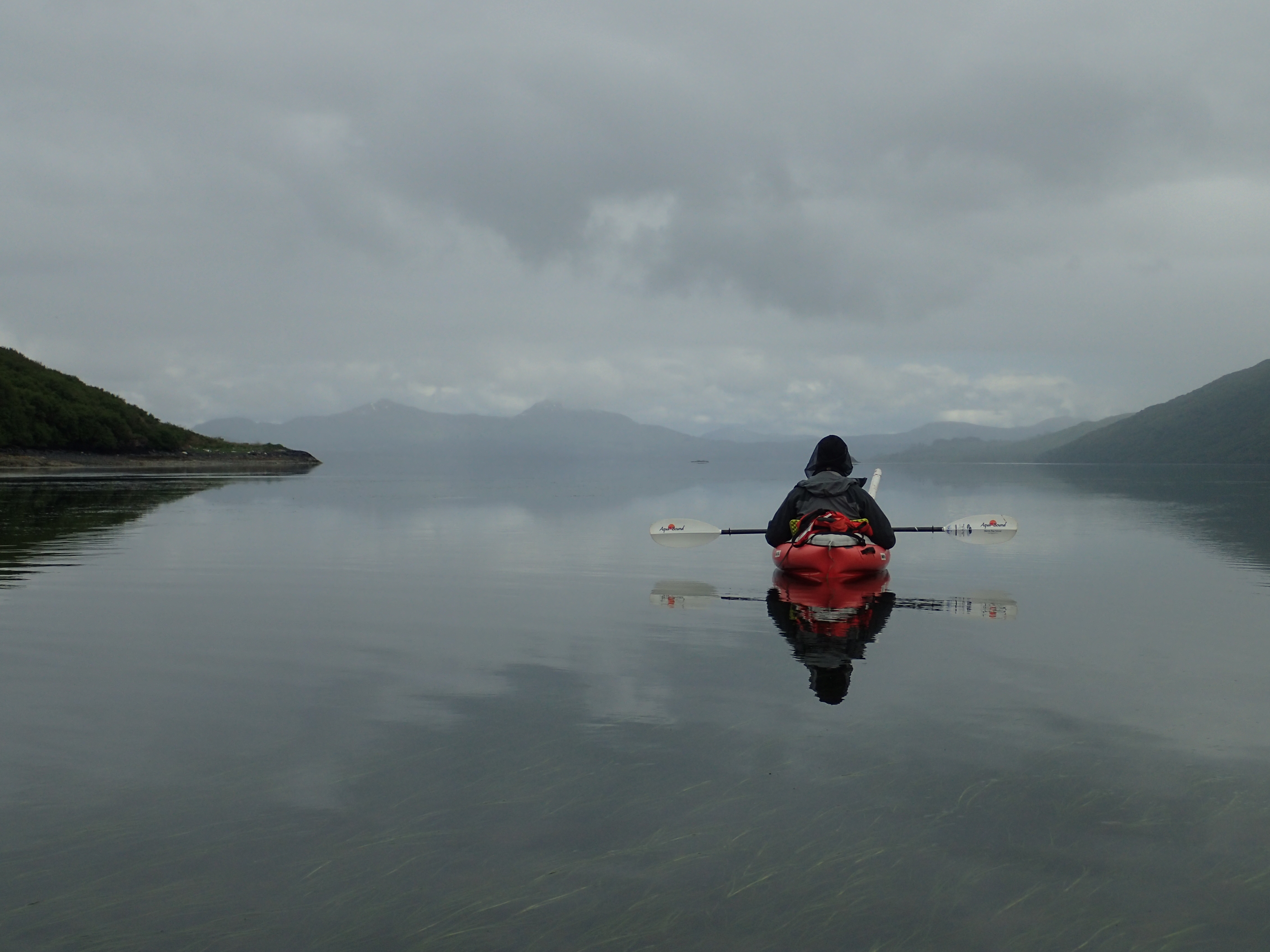 Afognak – Archaeologist Patrick Saltonstall using kayak to survey Afognak lands