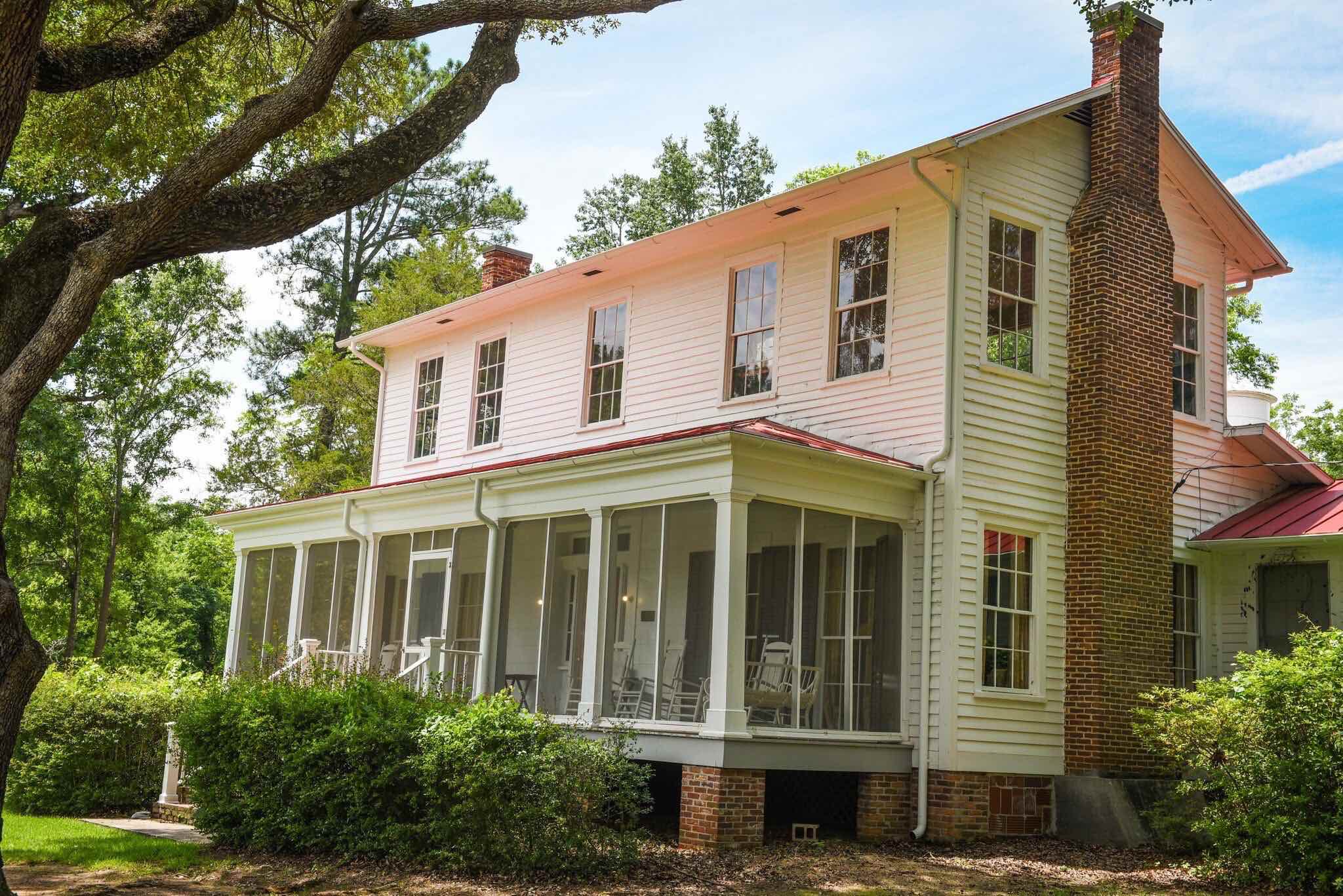 Plantation house with screened in porch