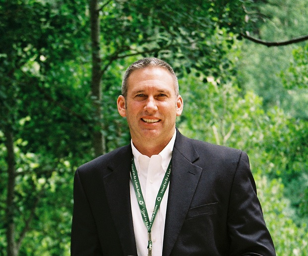 Shawn Benge with tree background Image of Shawn Benge with tree in background