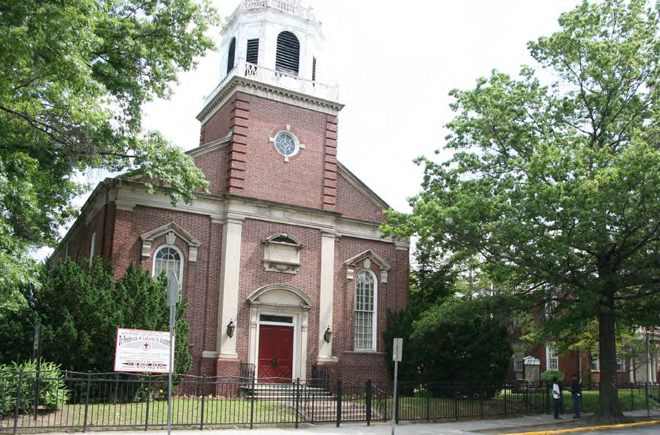 Brick church with a white steeple