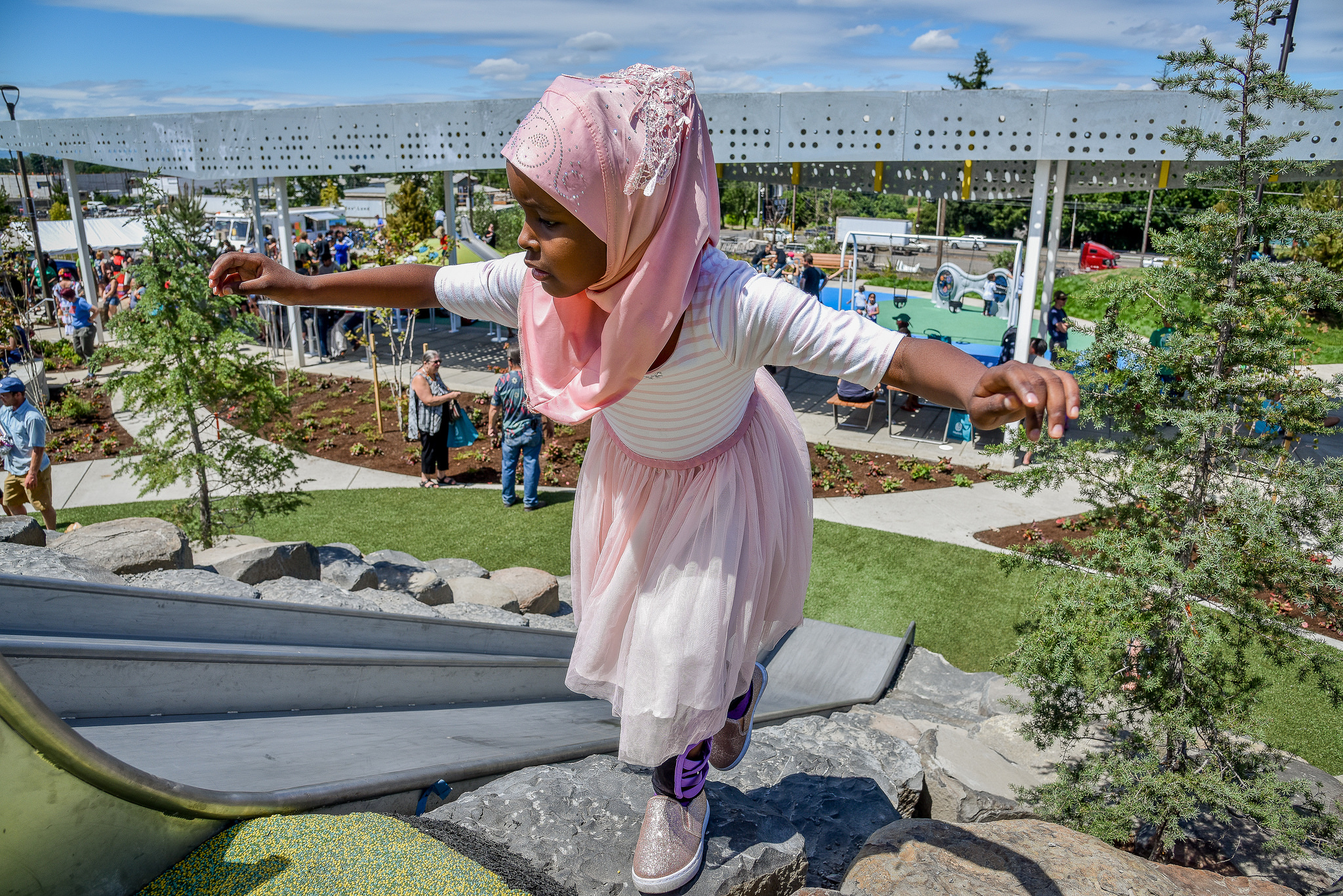 Cully Park grand opening Young girl climbs on playground equipment