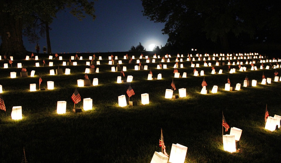 Luminaries on grave sites in a cemetery