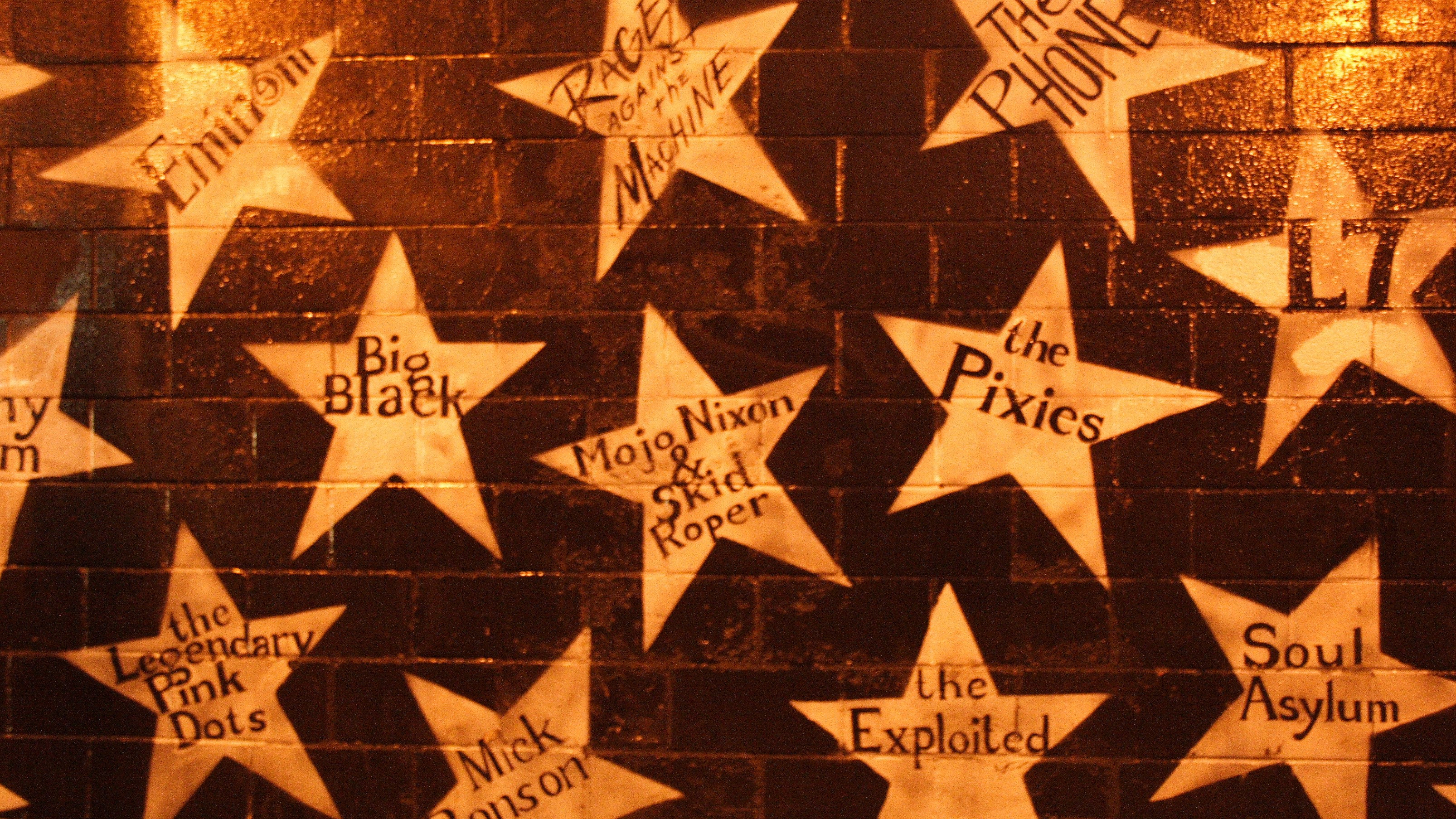 First Avenue Exterior Exterior of a building painted with large stars containing various musical artist's names.