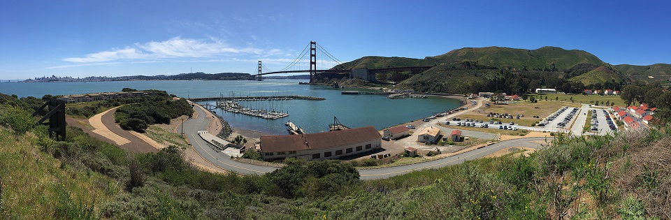 Aerial view of Fort Baker and parking area with the Golden Gate Bridge in the distance