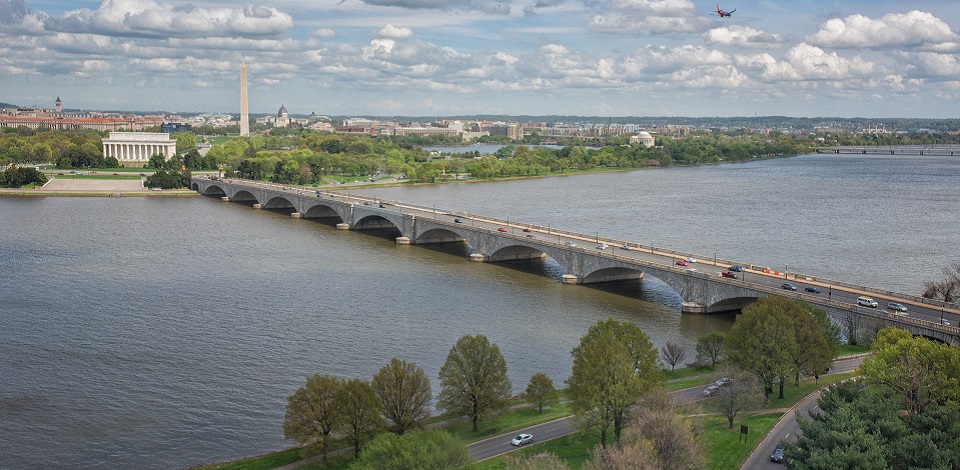 Arlington Memorial Bridge spanning across the Potomac River with the D.C. skyline in the background