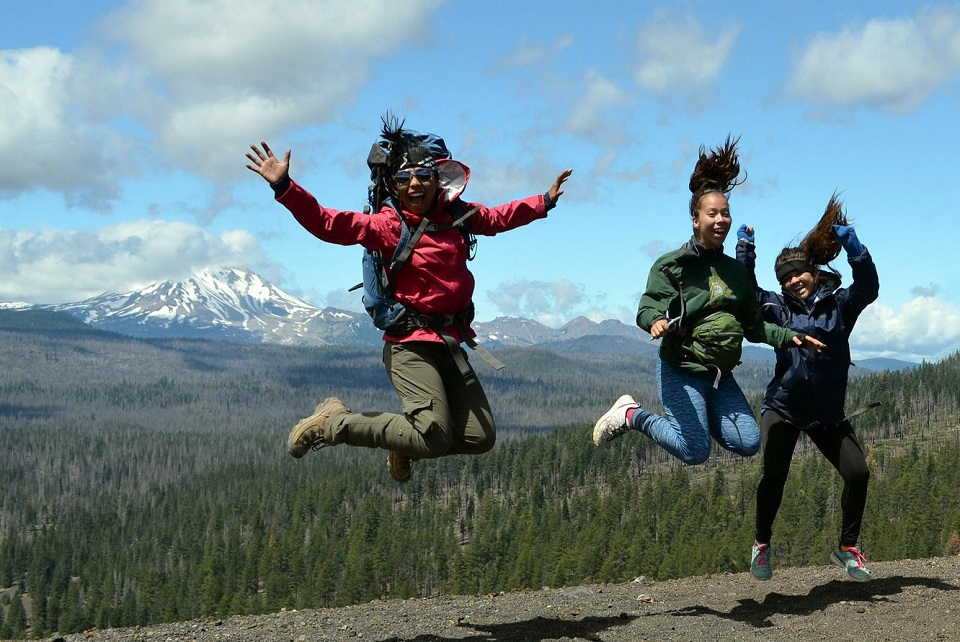 LAVO Jumpers Three people jumping with mountains in background