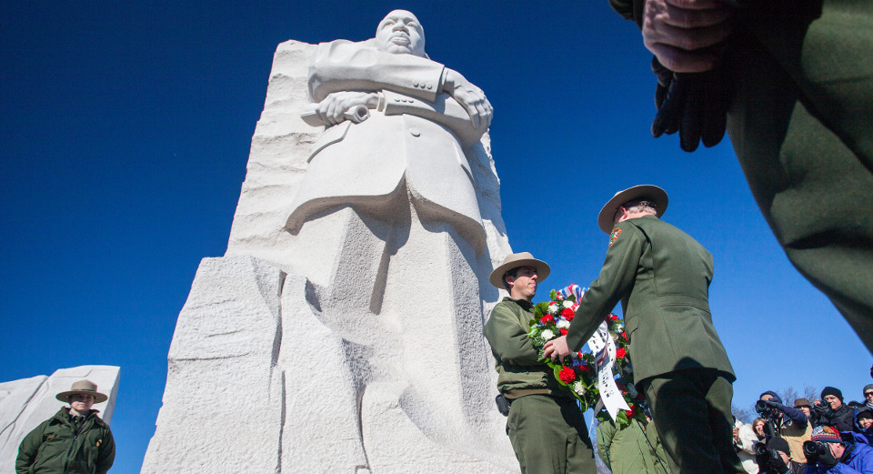 Statue of Martin Luther King Jr and park rangers taken from below 