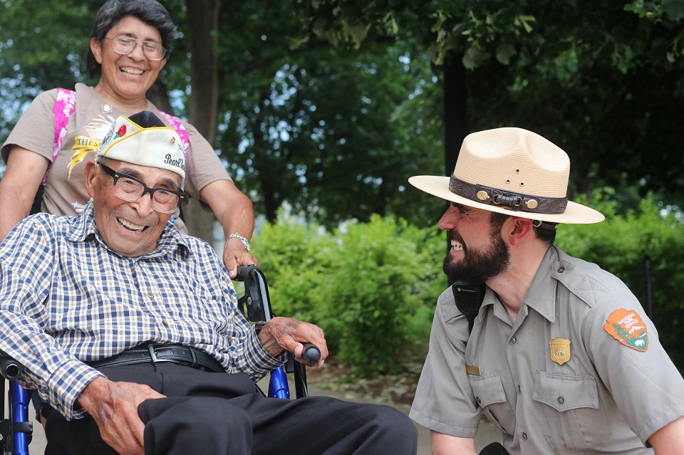 Ranger greeting a veteran and family member