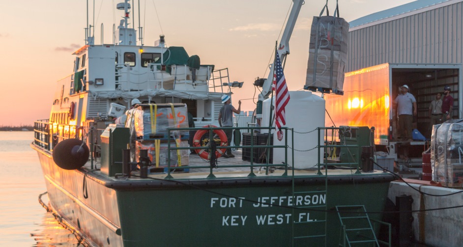 Motor vessel being loaded with supplies