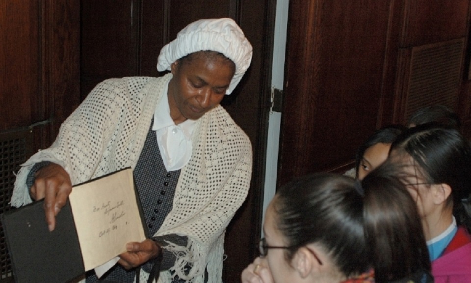 Reenactor portraying Soujourner Truth to two young girls